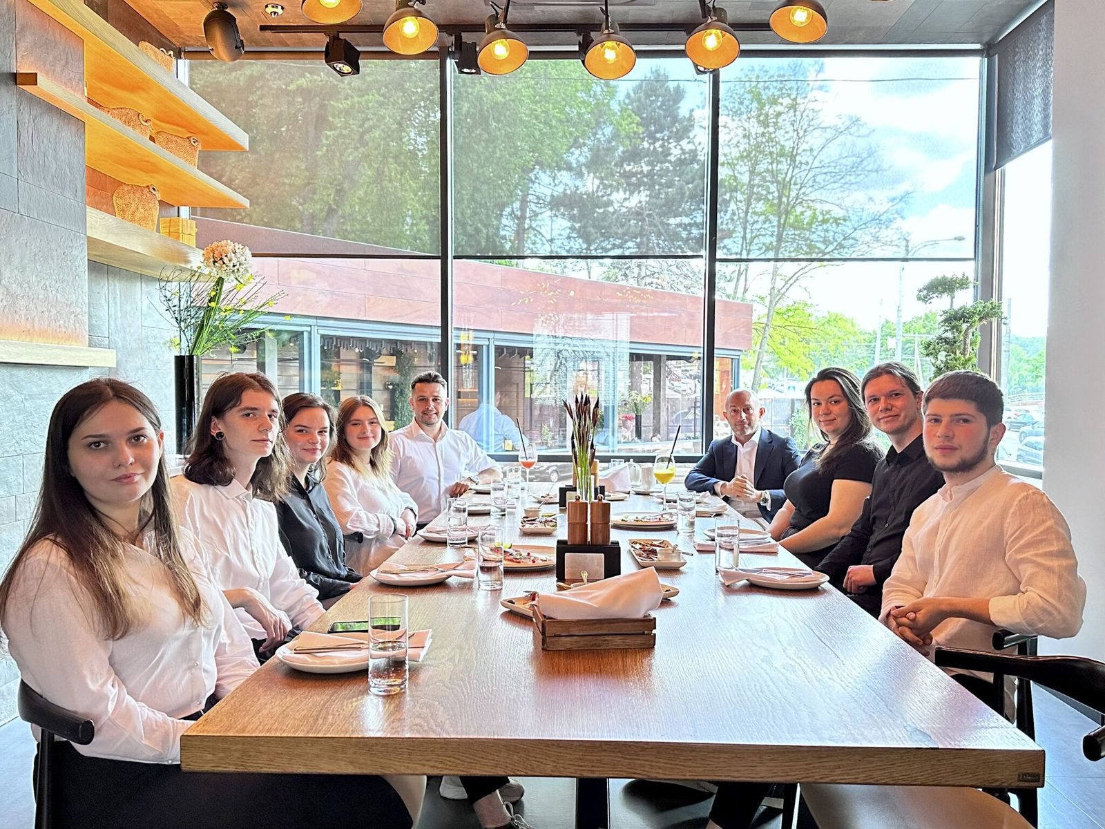 Melisa's second Talent Academy group at lunch with the company founder
